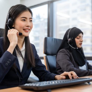 happy-smiling-asian-woman-call-center-operator-wearing-headsets-working-computer-talking-with-customer-with-her-service-mind Happy smiling asian woman call center and operator wearing headsets working on computer and talking with customer with her service mind